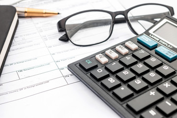 calculator and documents for working on the table, Finance and savings, Business concept.