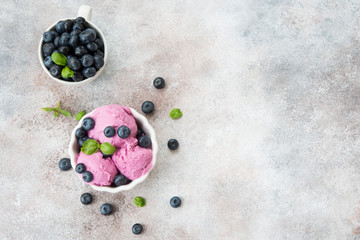 Homemade berry ice cream on a light concrete background. Top view