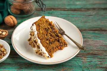 slice of carrot cake with walnut and cream cheese frosting