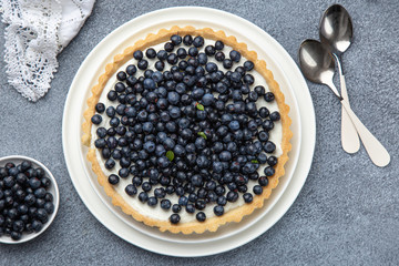 blueberry tart  on grey background