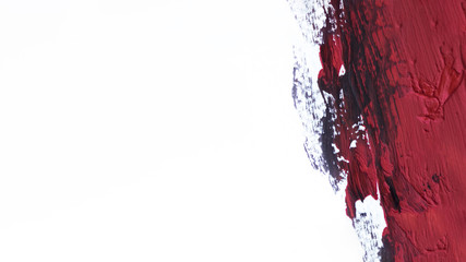 Red brush stroke on white background
