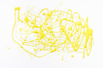 Yellow acrylic splash on white canvas