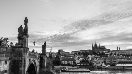 Prague, Czech Republic,22 July 2019: Charles Bridge with Vltava river and St. Vitus Cathedral in background