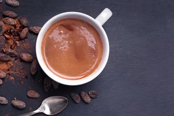 Foto op Aluminium Hot chocolate or cocoa in a mug on the black background © Diana Vyshniakova