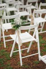 chair decorated with flowers for wedding