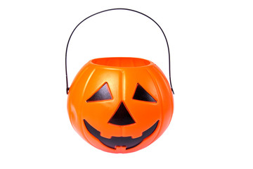 scary Halloween plastic pumpkin isolated on white background. Child collecting candy Jack o'lantern basket , trick or treat, seasonal celebration.