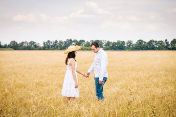 couple walking in a field