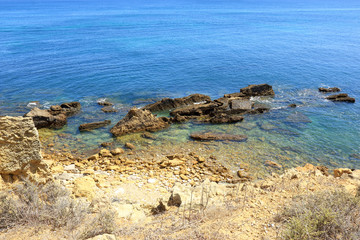 Fototapeta na wymiar Jagged Rocks jutting out from the Atlantic coast near Albufeira