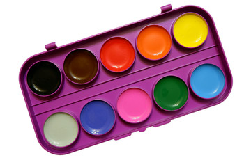 Round watercolor paints in a plactic box top view isolated on white background