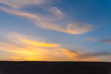 Fototapeta na wymiar Farmland, hill with blue sky background in dusk. Silhouette view nature landscape.