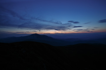 sunset in the mountains line of blue beautiful mountains