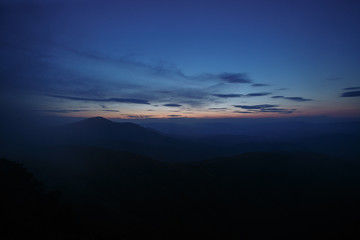 sunset in the mountains line of blue beautiful mountains