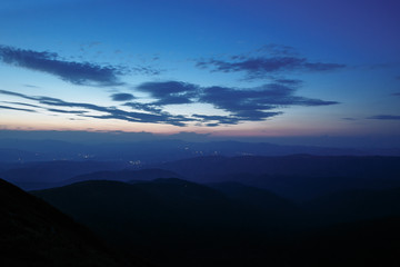 Fototapeta na wymiar sunset in the mountains line of blue beautiful mountains