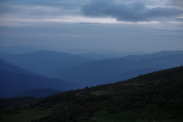 evening mountains indicated by fairy clouds