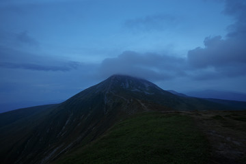 evening mountains indicated by fairy clouds