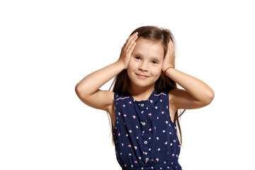 Close-up studio shot of beautiful brunette little girl posing isolated on white studio background.