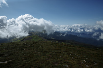 view from the top of the mountain to the old-fashioned mountains and beautiful clouds