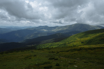 view from the top of the mountain to the old-fashioned mountains and beautiful clouds
