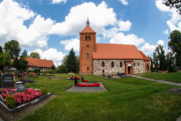 Old authentic brick church in a village