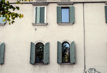 Fototapeta na wymiar Vintage windows in old house Verona Italy