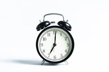 Black alarm clock isolated on white