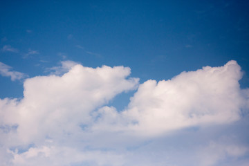 Naklejka na ściany i meble Thick white cloud on blue sky background.