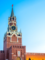 Fototapeta na wymiar Spasskaya tower, clock tower exit to Red Square, wall of Kremlin under twilight evening sky, Moscow, Russia
