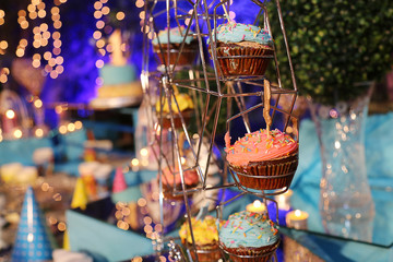 beautiful birthday cupcakes with  sprinkles. Ribbons and a gift