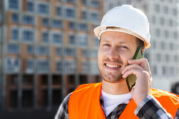 Close-up portrait of engineer talking on the phone