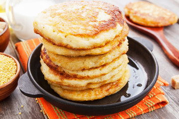 Millet pancakes in a frying pan
