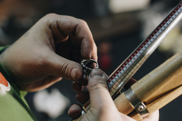 Close up of jeweler hand with ring