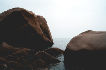 rocks in the ocean at italian coastline
