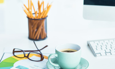 A cup of coffee on the office table