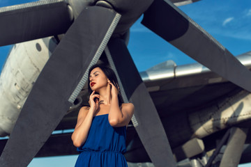 Brunette in a dress at the old airport