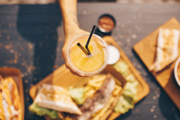  fast food and unhealthy eating concept - close up of fast food snacks and cola drink on wooden table. Fast food. Background. Hamburger. 