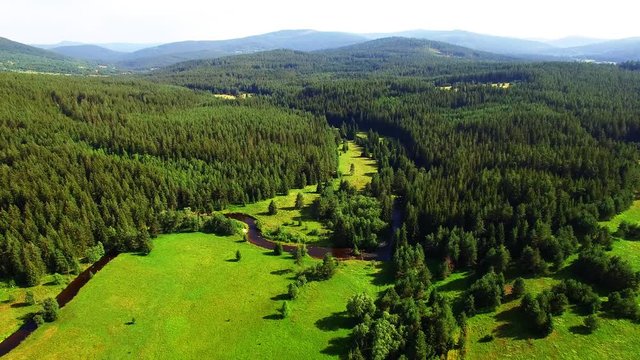 Camera flight over Gold-bearing river Kremelna in National Park Sumava. Amazing destination for hiking. Mountains in Czech Republic, Central Europe.