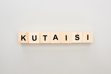 top view of wooden blocks with Kutaisi lettering on white background
