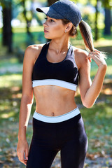 Sport girl. The girl is doing fitness exercises. Beautiful young sports woman doing exercises. A...