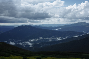 rain high in the mountains floods half the panorama of the mountains