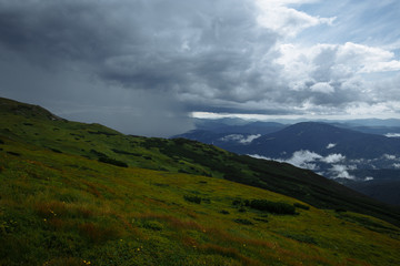 rain high in the mountains floods half the panorama of the mountains