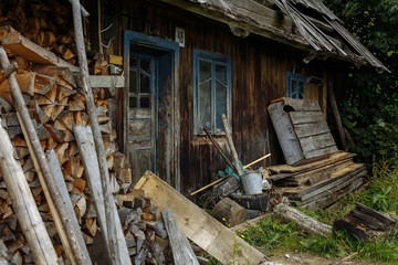 Fototapeta na wymiar old colorful house with logs