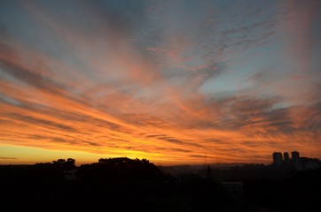 Sunset in the city and orange clouds. São Paulo, Brazil