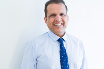 Middle age business man smiling to the camera