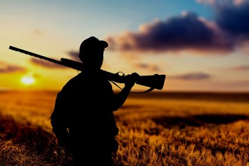 Male Hunter with Rifle on natural background
