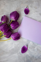 Purple letter with a lovely bouquet of tulips