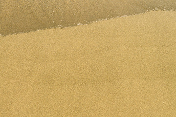 Yellow sand with wave background