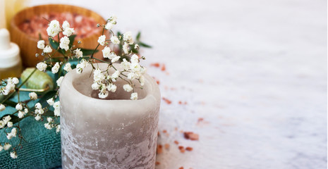 Close up view of candle and flowers