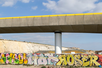 overpass at brighton marina with grafitti