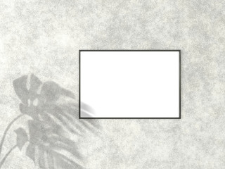 2x3 horizontal Black frame for photo or picture mockup on concrete background with shadow of monstera leaves. 3D rendering.