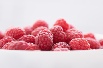 Common raspberries. Fresh ripe red fruits. Close-up